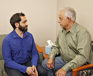 Man talking to mental health professional.